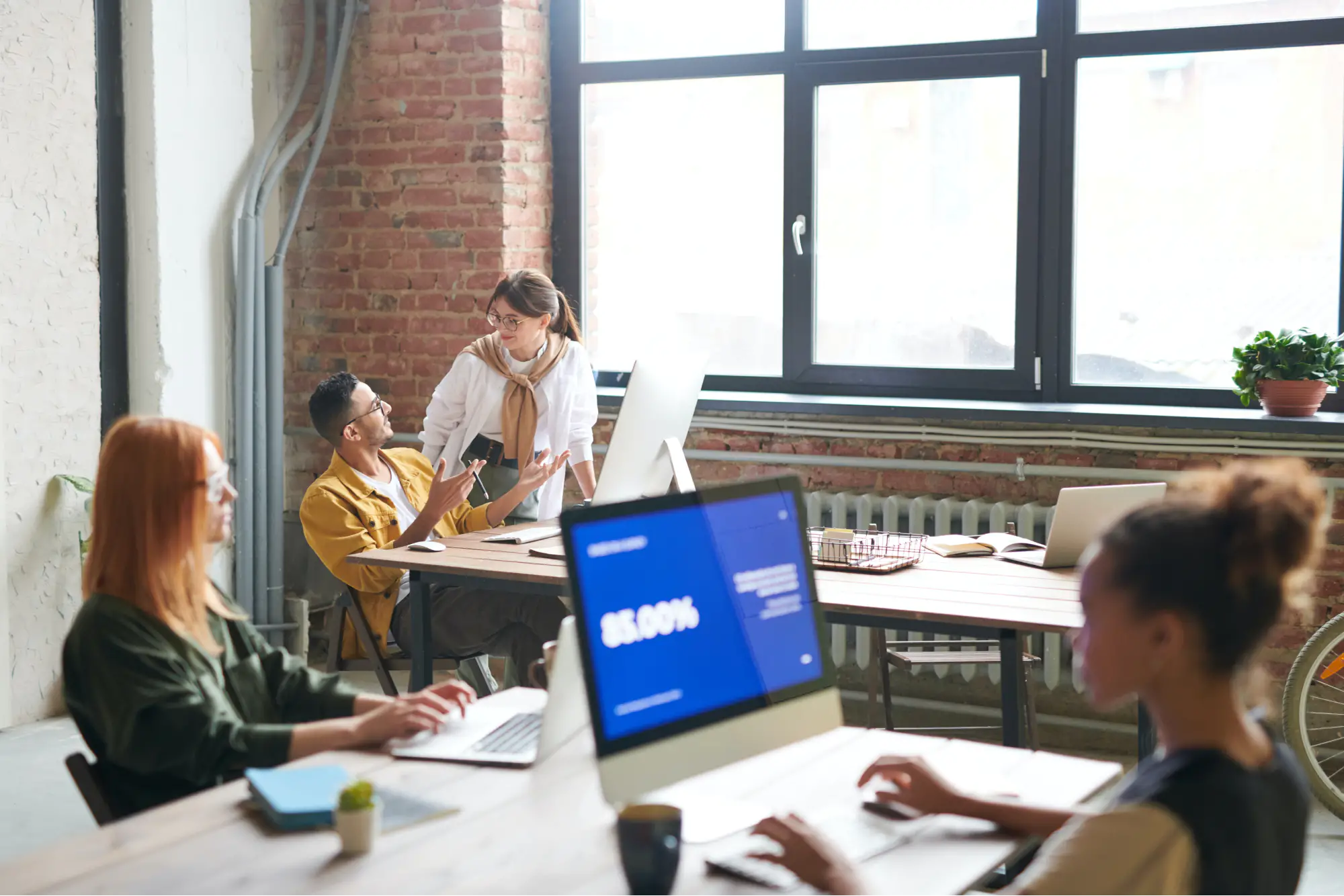 People working in front of computers in a studio